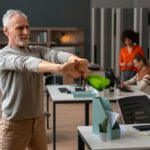 man-office-stretching-work-day_23-2150468564-1-1024x683