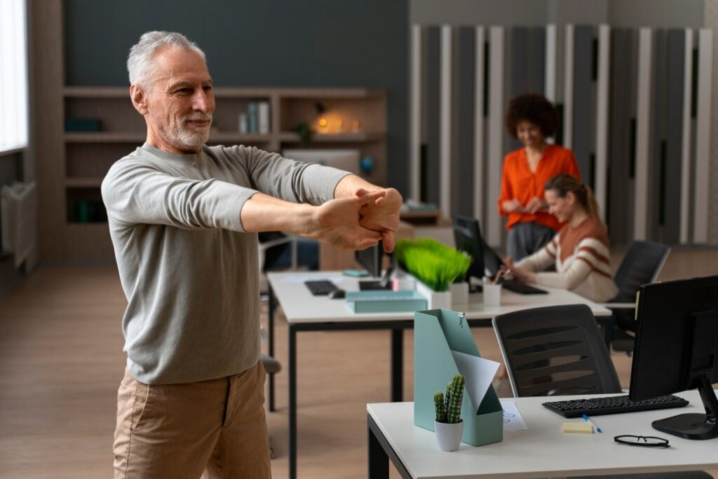 man-office-stretching-work-day_23-2150468564-1-1024x683